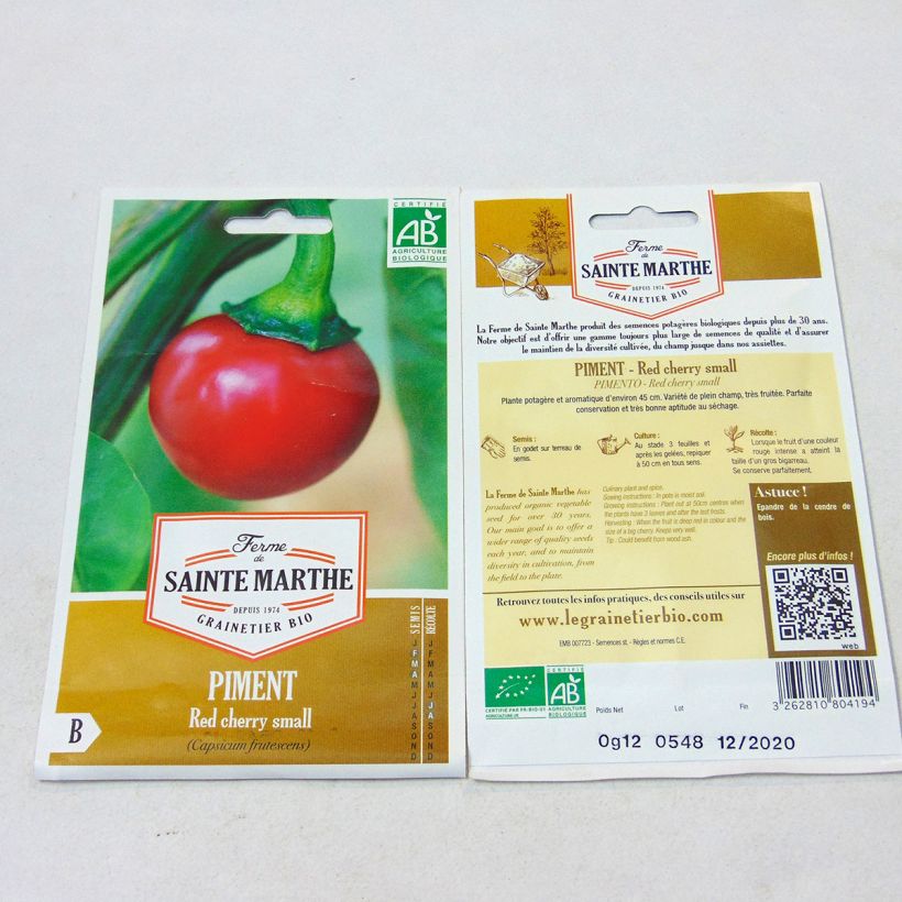 Beispiel eines Exemplars von Chili Red Cherry Small Bio - Ferme de Sainte Marthe die Tüte mit 20 Samen wie geliefert